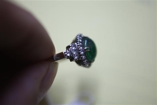 A yellow metal, cabochon emerald and white sapphire? cluster ring, size K.